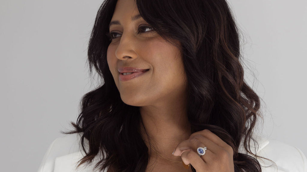 Woman wearing a white dress with a plain background